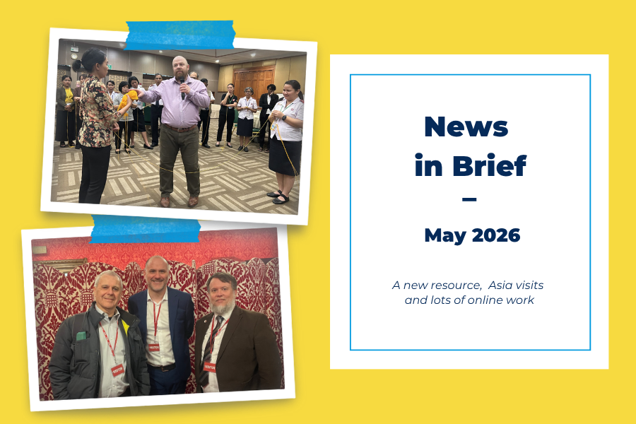 Graphic on a yellow background with the heading "News in Brief - May 2026" and the writing "A new resource, Asia visits and lots of online work". Includes two framed photos. The top photo shows Dan with a group of people doing an exercise with string. The bottom photo shows three men standing together wearing red "Visitor" lanyards in front of a patterned red screen.
